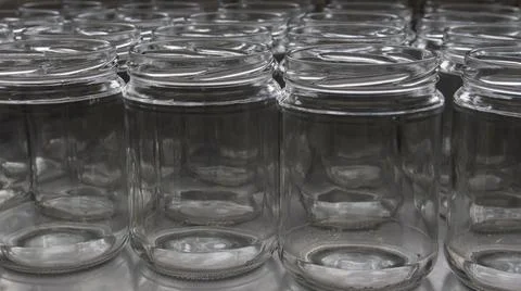 Empty glass jars in the artisanal process of making organic yogurt Stock Photos
