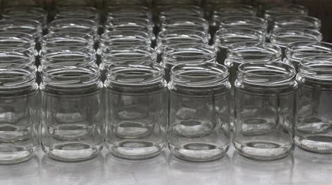 Empty glass jars in the artisanal process of making organic yogurt Stock Photos