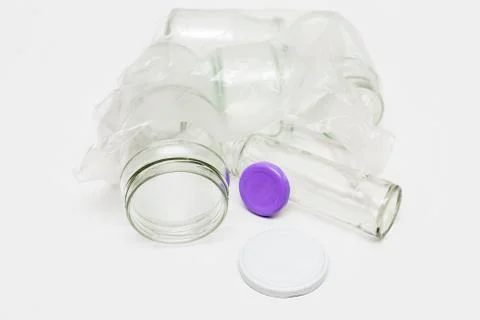 Empty glass jars in plastic bag Stock Photos