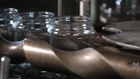 Empty glass jars running on a conveyor line in a tomato processing plant Stock Footage 118575504