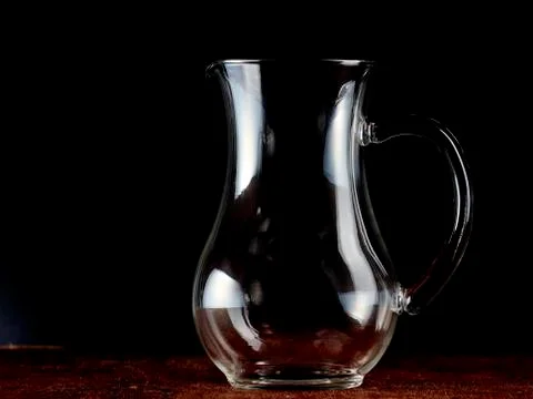 Empty glass jug Stock Photos