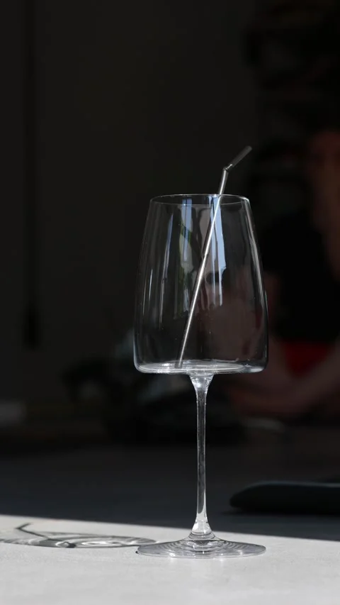 Empty Glass with Metal Straw on Table Stock Footage 313962379