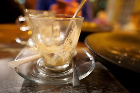 Empty glass mug after drinking coffee. Stock Photos