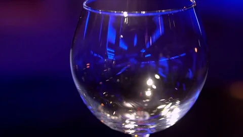 In an empty glass poured red wine, red wine pours in the restaurant Stock Footage 84333754