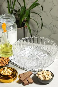 Empty Glass Serving Bowl with Nuts, Pistachios, Almonds and Olive Oil on Kitchen Stock Photos