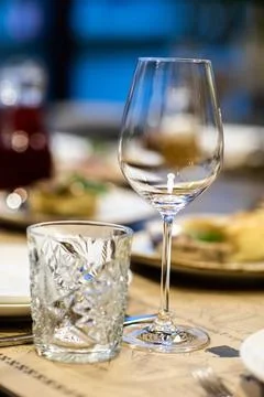 Empty glass set in restaurant. wedding, decor, celebration, holiday concept - Stock Photos