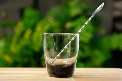 Empty glass with spoon Stock Photos