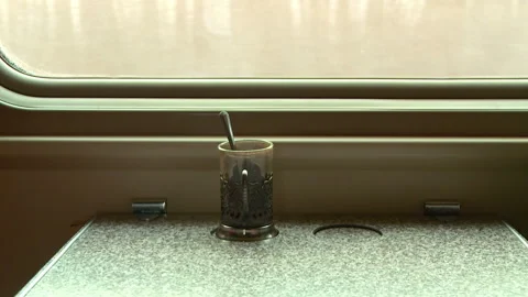 Empty glass on the table in the passenger car in the fall Stock Footage 105277644