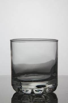 Empty glass of whisky on white background Stock Photos
