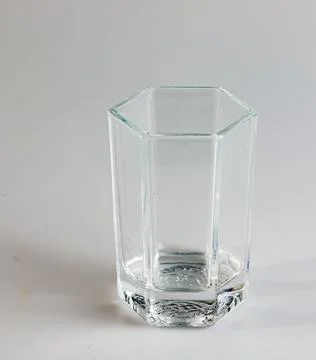 Empty glass on a white background. Transparent glass. Stock Photos