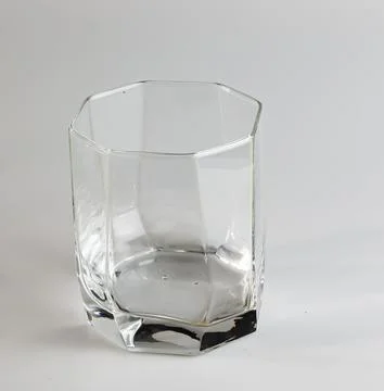 Empty glass on a white background. Transparent glass. Stock Photos