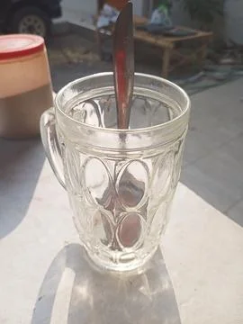 Empty glass on white surface Stock Photos