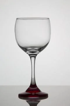 Empty glass of wine on white background Stock Photos