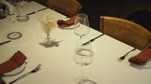 Empty glasses are on the tables in an empty restaurant Stock Footage 157810834