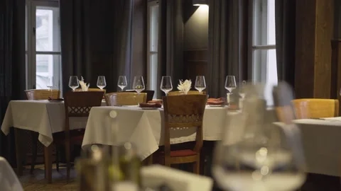 Empty glasses are on the tables in an empty restaurant. Stock Footage 157810837