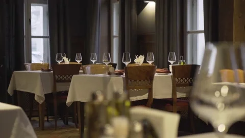Empty glasses are on the tables in an empty restaurant Stock Footage 157810842