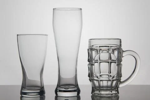Empty glasses of beer on white background Stock Photos