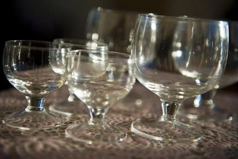 Empty glasses closeup in the table background Stock Photos
