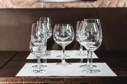 Empty glasses of different shapes served for a wine tasting Stock Photos