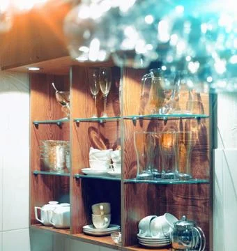 Empty  glasses hanging above the bar in the restaurant. Stock Photos