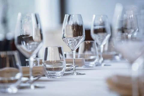 Empty glasses in restaurant. Cutlery on the table  Stock Photos