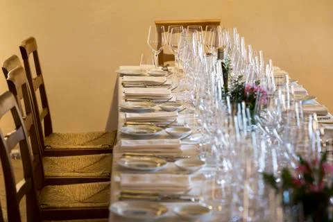 EMPTY GLASSES ROW RESTAURANT TABLE Stock Photos