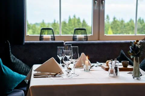 Empty glasses set in restaurant. Part of interior Stock Photos