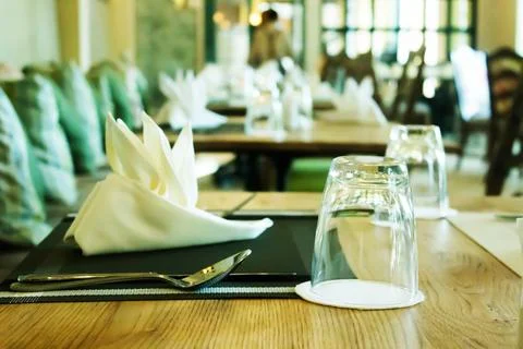 Empty glasses set on table in restaurant Stock Photos