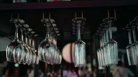 Empty glasses stand in rows on the bar counter Stock Footage 244117928