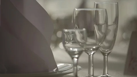 Empty glasses for wine and champagne, cognac and vodka stand on the table Stock Footage 129085032