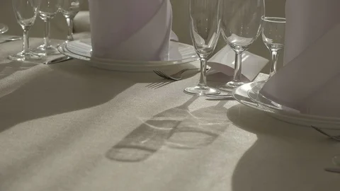 Empty glasses for wine and champagne, cognac and vodka stand on the table Stock Footage 129085065