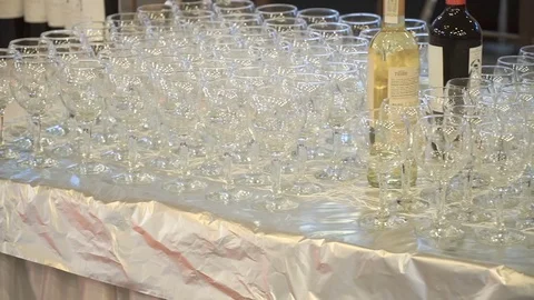 Empty glasses for wine and water set on a festive table in a restaurant focus Stock Footage 78161605