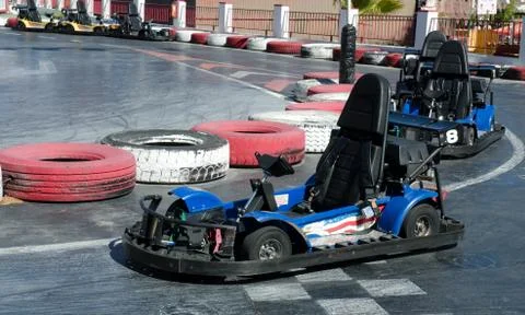 Empty go-kart by side of track Stock Photos