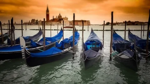 Empty Gondolas in Venice Moored by San Giorgio Maggiore Church at Sunset, Italy Stockbeeldmateriaal 122531448
