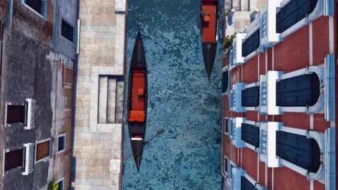 Empty gondolas on water canal in Venice Top view 4K Stock Footage 112777854