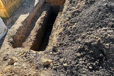 Empty grave plot at a Muslim cemetery 스톡 사진