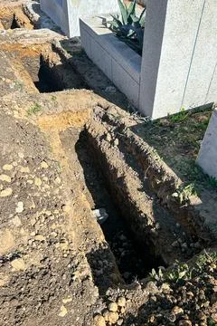 Empty grave plot at a Muslim cemetery Stock Photos