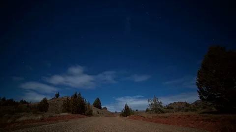 Empty gravel road under the moon and stars night near Painted Hills Stock Footage 81664095