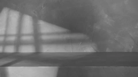 Empty gray concrete stage and wall background with shadow light of window Stock Footage 229386112