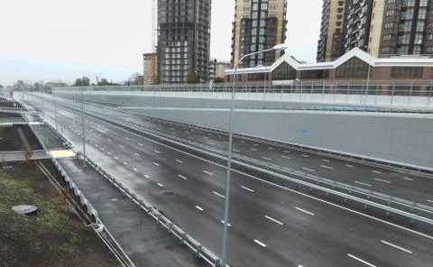 Empty gray highway, outgoing to the horizon. Soft focus. Stock Photos