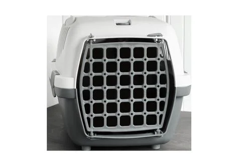Empty gray plastic pet carrier isolated on white chroma key background clos.. Stock Photos