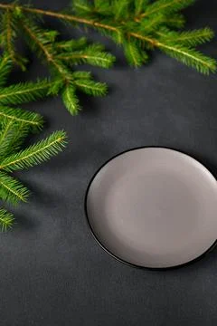 Empty Gray Plate with Black Border and Green Branches of Christmas Tree on Da Stock Photos