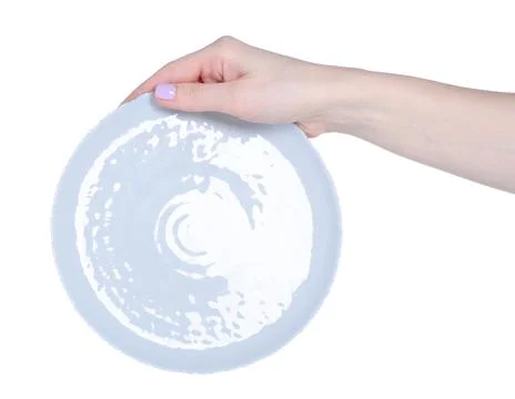 Empty gray plate in hand Stock Photos
