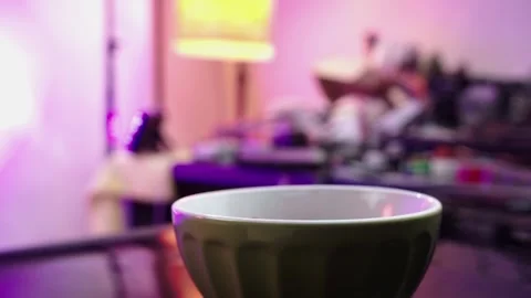Empty green bowl waiting for falling nuts in messy kitchen Stock Footage 302345480
