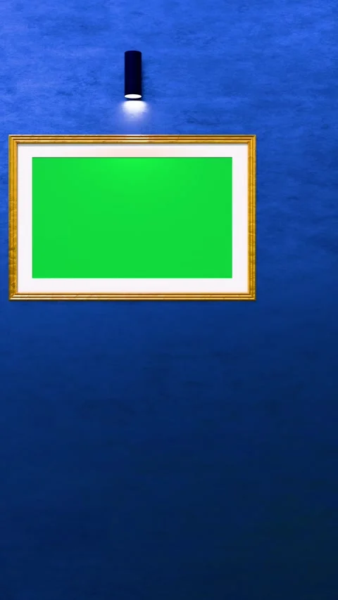 Empty green canvas in gold-silver frames on blue wall under soft lighting 库存影片 337771614