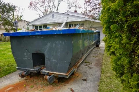 Empty Green Dumpster With Debris Stock Photos