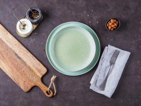 Empty green plate on dark background. Stock Photos