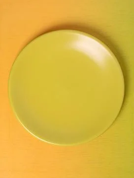 Empty green plate on smooth gradient background ideal for text placement Stock Photos