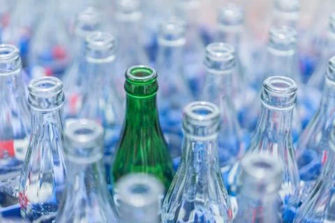 Empty green soft drink bottles are kept neatly in the restaurant. Stock Photos