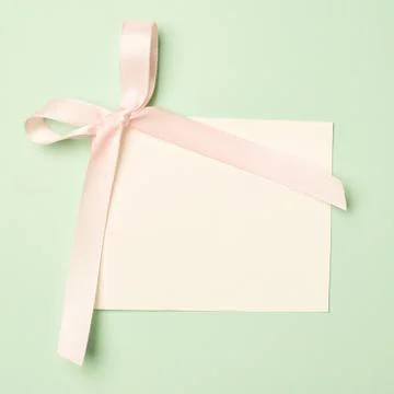 Empty greeting card over a mint green background Stock Photos